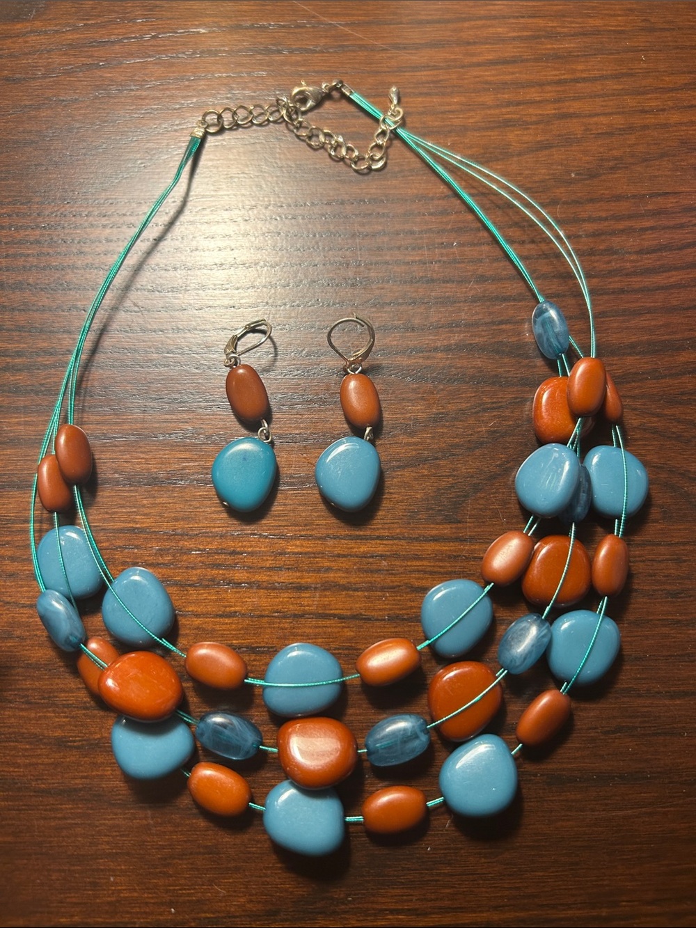 Multistrand Blue and Rust Bead Necklace and earrings